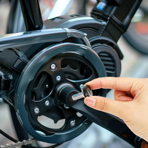 Inserting 2 Pack 8mm Bike Hex Crank Arm Bolt With Cap into mountain bike's capless bottom bracket for secure fit and installation