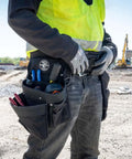 Worker wearing Electrician Tool Belt And Pouch Set With 11 Pockets And 4 Pieces Padded Cordura Belt With Hammer Holder on site.