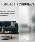 Upgrade Your Living Space With These Kickback Style Bifold Barn Doors Featuring Smooth Gliding Frosted Glass Panels 28X84 Inches showing tempered frosted glass in a modern living room.