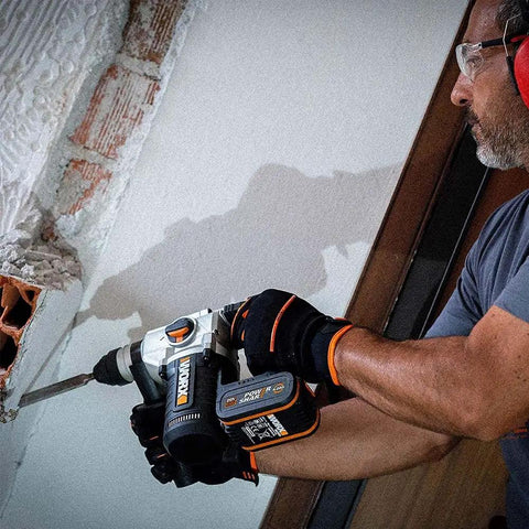 Built Different Heavy Duty Cordless Rotary Hammer Drill With Brushless Motor and Variable Speed Trigger in action drilling masonry.