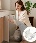 Woman demonstrating Ultra Thin Magnetic Door Catch 2 Pack No Drill Self Adhesive Invisible Cabinet Latch for strong hold.