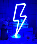 Lit Lightning Bolt Neon Sign With Base USB And Battery Powered Blue LED Light For Bedroom Decor on desk with flowers