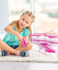 Girl playing with Pink RC Helicopter For Kids And Beginners 2.4GHz 3.5 Channel Indoor Flight Toy With LED Lights Easy To Fly Gift