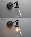 Industrial Vintage Wall Sconce Light Fixture With Slope Pole Mount And Funnel Flared Clear Glass Shade, Matte Black Finish, on and off stages