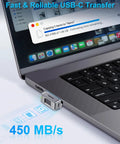 Fingerprint Nano SSD 512GB External Solid State Drive Up To Four Hundred Fifty Megabytes Per Second Pocket Sized Keychain Portable Backup For iPhone iPad MacBook Steam Deck PS5 And More showing data transfer to a MacBook at 450 MB/s.