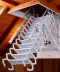 Electric Telescoping Loft Ladder With Smooth As Butter Remote Control Pull Down Attic Stairs, mounted in attic with handrails.
