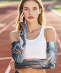 Stay Dope In The Heat With These Fly Ice Silk Arm Sleeves Designed Around A Sharp Mechanical Shark Look To Secure Ace Sunproof Coverage Snug Elastic Fit And Zero Sweat Summer Vibes on a model wearing white tank top.