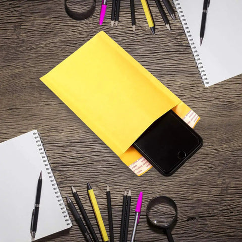5 By 7 Inch Bubble Mailers 50 Pack Padded Envelopes Self Seal Kraft Paper Mailers with phone inside on wooden desk with stationery