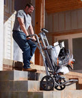Man transporting Mobile Miter Saw Stand With Universal Mounting Brackets And Tool Free Extension Lock Quick Release For Fast Setup On The Go