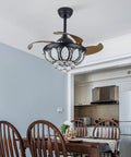 FAIRYPAGODA Retractable Ceiling Fan with Light and Handheld Controller, black design with crystal accents in dining room.