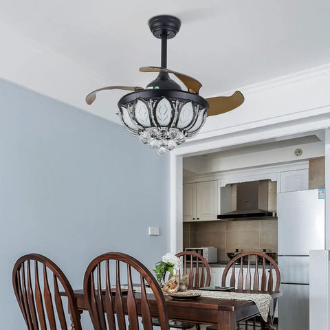 FAIRYPAGODA Retractable Ceiling Fan with Light and Handheld Controller, black design with crystal accents in dining room.