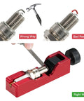 Universal Spark Plug Gap Tool With 32 Steel Feeler Blades adjusting spark plug gap correctly with red handheld tool.