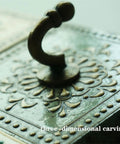 Close-up of Built Tough Rustic Wall Mounted Coat Rack With Heavy Duty Hooks showing detailed three-dimensional carving.