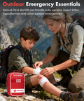 Front view of red Senvok first aid kit on rocky ground as adult wraps knee of child outdoors