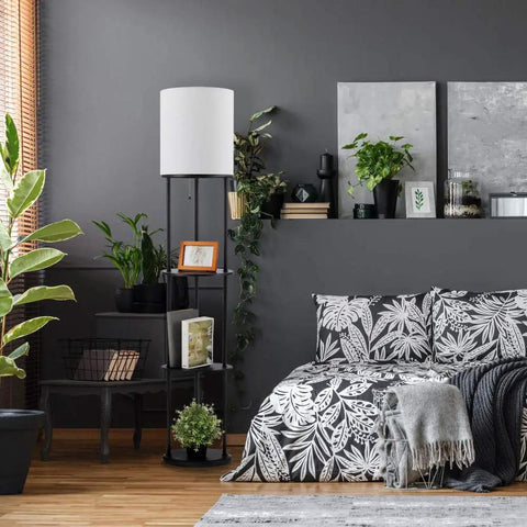 Versailles Floor Lamp With Built-In Shelves, 57.5 Inch Matte Black, White Linen Shade beside bed in modern room setting