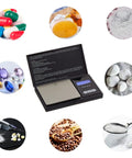 Compact Pocket Digital Scale For Food And Jewelry Delivers 0.01g Precision Up To 500g Ultra Portable Travel Friendly Lightweight Yet Sturdy Battery Included Easy Setup And Clear Readouts For Everyday Use. Scale surrounded by small items for precise weighing.