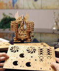 Hands holding parts of Wooden Marble Run Dragon Kit Hands On 3D Mechanical Model With Marble Track and 15 Steel Balls.
