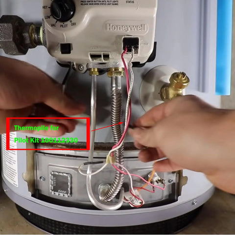 Milivolt thermopile pilot kit 100112330 installed on gas water heater; copper plumbing and Honeywell valve visible
