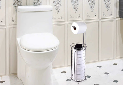 Freestanding Toilet Paper Roll Holder Stand Dispenser with Built In Storage Shelf in stainless steel next to a toilet in a bathroom