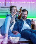 Couple enjoying LED TV Backlight Strip 32.8Ft USB Powered With Remote for 40 To 75 Inch TVs Behind The Screen Perfect For Bedroom Gaming Setup