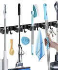 Two Pack Heavy Duty Broom Holder Wall Mount With Five Racks And Four Hooks Stainless Steel Mop And Broom Organizer in use