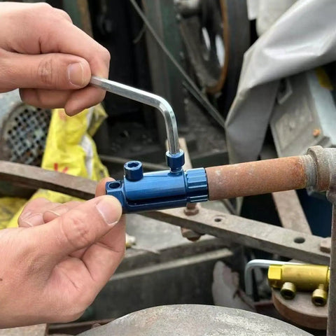 Person using Beefy Heavy Duty Pipe Extractor And Screw Extractor Set For Pipe Wrench And Faucet Removal on rusted pipe.