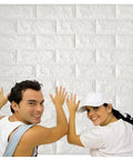 People installing Dope 3D Brick Wall Sticker Kit, 10 Large PE Foam Tiles, 59 Sq Ft, Self Adhesive, Waterproof Wallpaper