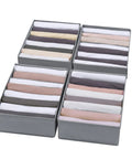 4 Pack T Shirt Drawer Organizers Set With 8 Grid Small Compartments And 5 Grid Medium Compartments filled with folded clothes