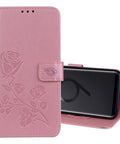 Pink floral embossed phone case with kickstand, showing closed front view and open side view with a smartphone in place.