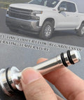 Hand holding Thermostat Bypass Kit for 6L80 6L90 and 8L90 Transmissions with CNC Machined Parts and O Rings; truck in background