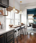 Brass Gold Glass Dome Pendant Lights Set Of 3 For Kitchen Island Sleek Industrial Modern Hanging Fixture With Handblown Clear Glass in kitchen setting