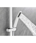 Hand shower of the Wall Mounted Waterfall Shower System with Hand Shower sprays water against a gray tiled wall.