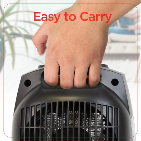 Hand holding compact ceramic space heater with "Cozy Up Your Desk With This Personal Ceramic Space Heater For Office Or Home, Two Heat And Fan Settings, Adjustable Thermostat, Compact Desk Heater That Keeps You Warm And Focused On Work All Day"