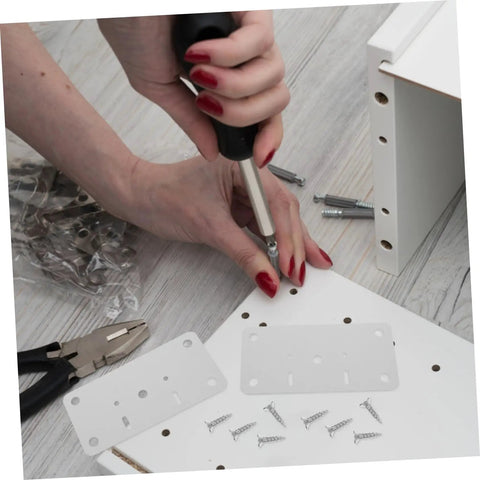Person using screwdriver to install Stainless Steel Hinge Repair Plate Kit For Cabinets And Doors 10 Sets Easy To Use Quick Fix