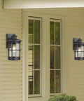 Outdoor Wall Sconce Lighting Fixture Finished In Black With Seeded Glass Set Of 2 For Exterior Walls Perfect For Entryways Porches Patios And More Durable Metal Exterior Lighting 7.5 In Tall 6.5 In Wide 12.2 In High installed on exterior wall