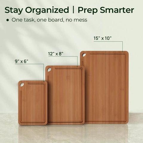 Three-piece Bamboo Cutting Board Set with Deep Juice Grooves and Built-In Handles in sizes 15x10, 12x8, and 9x6 inches.