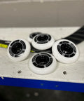 Indoor Roller Hockey Wheel Set 76 And 80 Durometer Hybrid Ceramic Bearings 78A Eight Pack on white table
