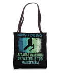 Retro Wing Foil Tote Bag for Wingsurfing Fans with Vintage Man on a Wingboard Design text 'Wing Foiling Because Walking on Water is Too Mainstream'