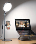 Ring Light With Desk Stand For Video Creation And Makeup, Dimmable LED With 30 Light Modes next to laptop on stand for Zoom calls.
