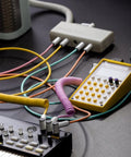 MickXer 5 Way Passive Mixer With Candycord Color Cables Six Pack And Noise Filtering Kit in use with audio equipment on desk