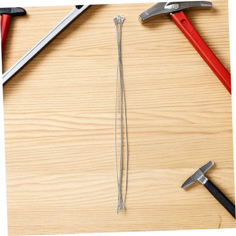 Four Piece Round Heat Sealer Heating Wire Replacement Strips for Manual Shrink Wrap Bag Sealer on wooden surface with tools.