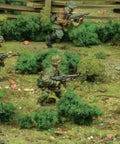 30 Piece Mid To Late War Waffen-SS Grenadiers Plastic Miniatures For Bolt Action WW2 Tabletop War Gamers Displayed in Terrain