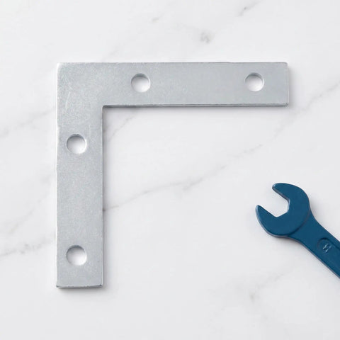 L Shape Metal Corner Brackets 100 Pcs 2.17 By 2.17 Inch Silver Iron Frame Supports for shelves with wrench on marble surface