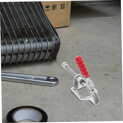 A single horizontal clamp of the Four Piece Push Pull Toggle Clamps Set for Woodworking and Metal Workholding on a workbench.