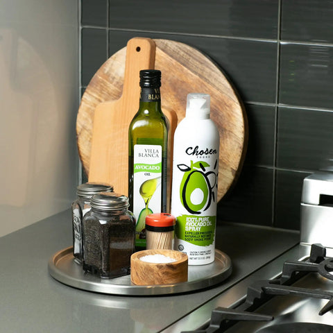 Slick Brushed Stainless Steel Lazy Susan Turntable Is A Game Changer For Pantry And Fridge Storage with oils and spices.