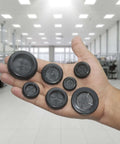 Hand holding 52 Piece Rubber Grommets Kit With Firewall Hole Plugs In Six Hole Sizes for wire protection and automotive repair