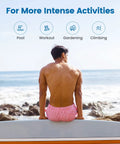 Back view of man sitting by sea wearing 2 In 1 Mens Swim Trunks With Built In Compression Liner For Support 7 Inch Board Shorts