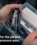 Close-up of bike brake bleed kit for Magura hydraulic disc brakes with 100ml mineral oil, syringes, and bleed block in a case.