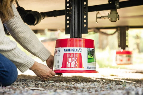 Heavy Duty Trailer Jack Blocks 2 Pack With Magnets For RVs And Trailers, Leveling Stabilizers And Jack Stands in use on gravel
