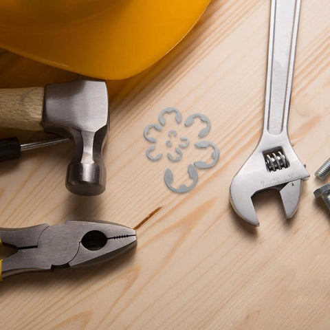 Premium Stainless Steel Set Of External Retaining Rings And C Clamps For M1.5 To M10 Fasteners, tools arranged on wood surface.
